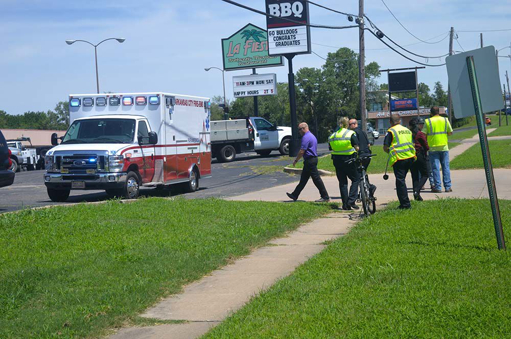 Bike rider hits vehicle in Ark City